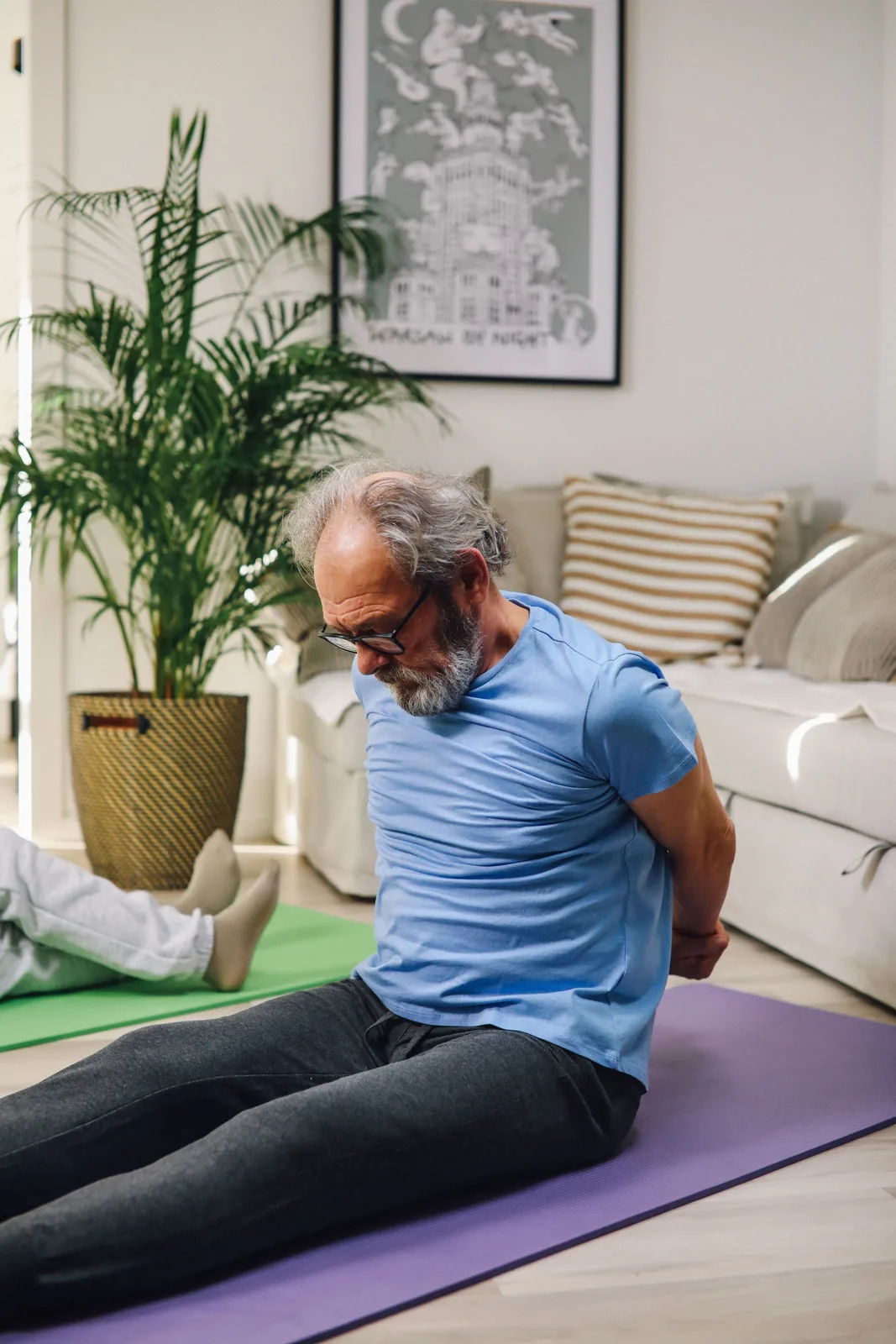 Active older man beginning a gentle morning movement routine